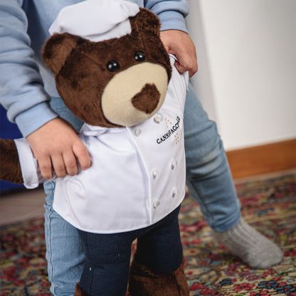 Bambino che tiene in braccio il peluche Tony Bear